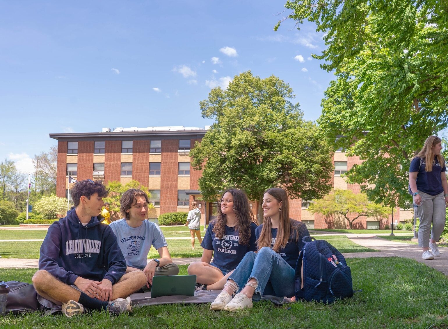 LVC students sit on social quad in spring