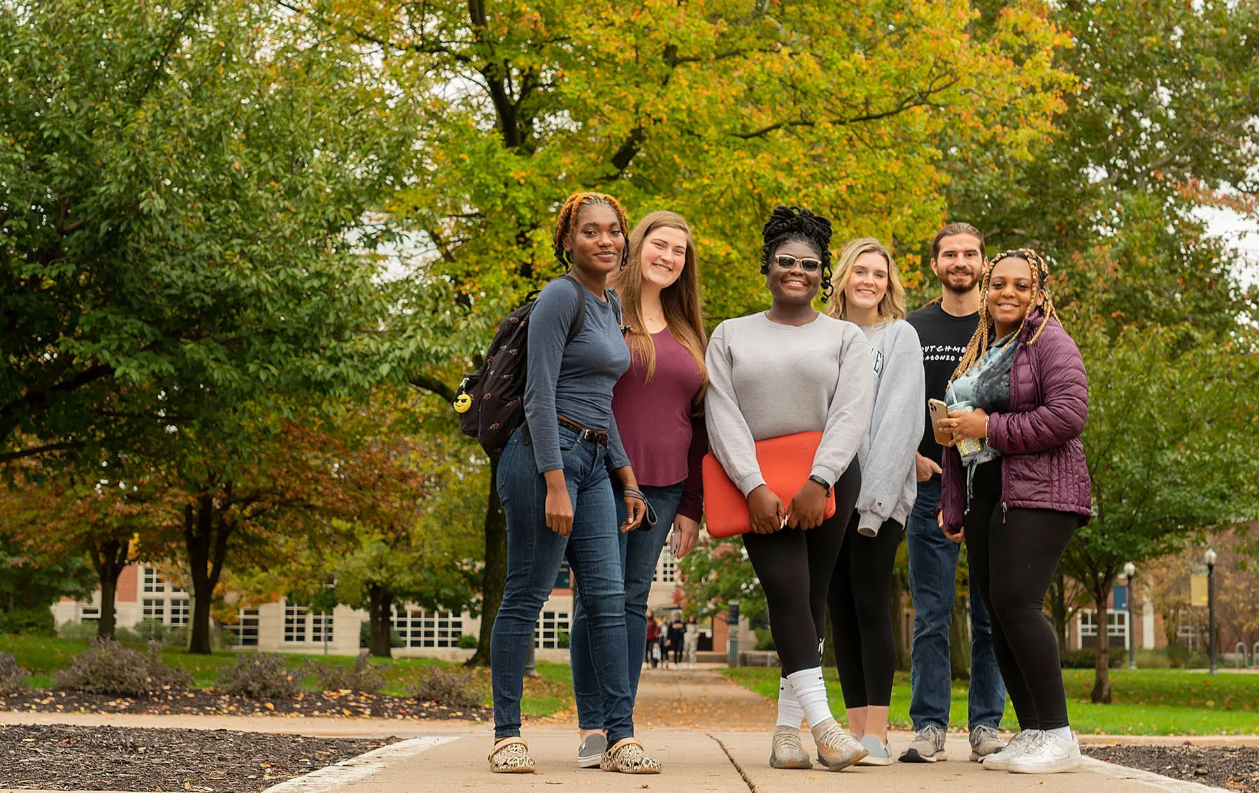 Students pose on campus.
