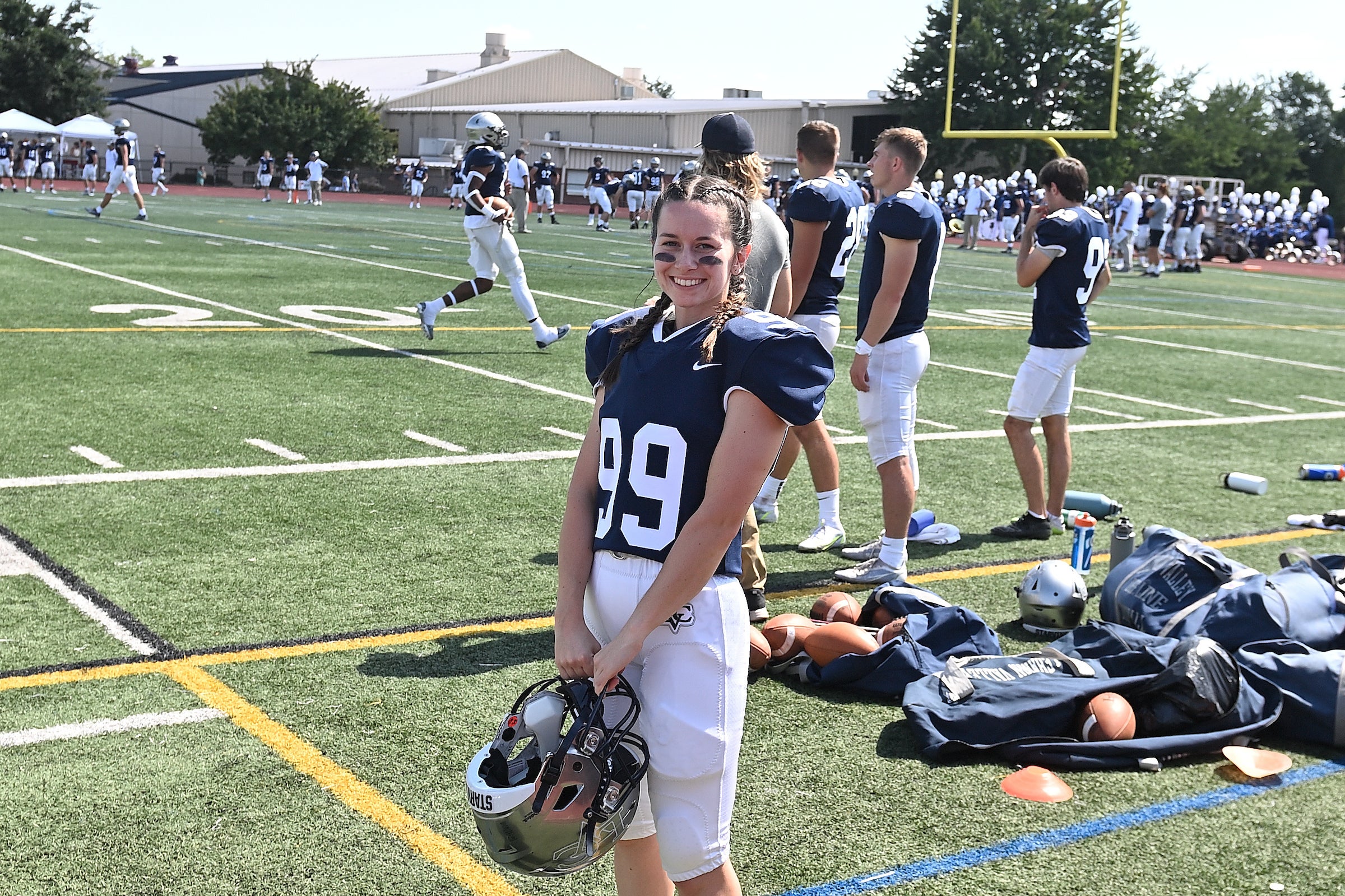 LVC football player poses on field