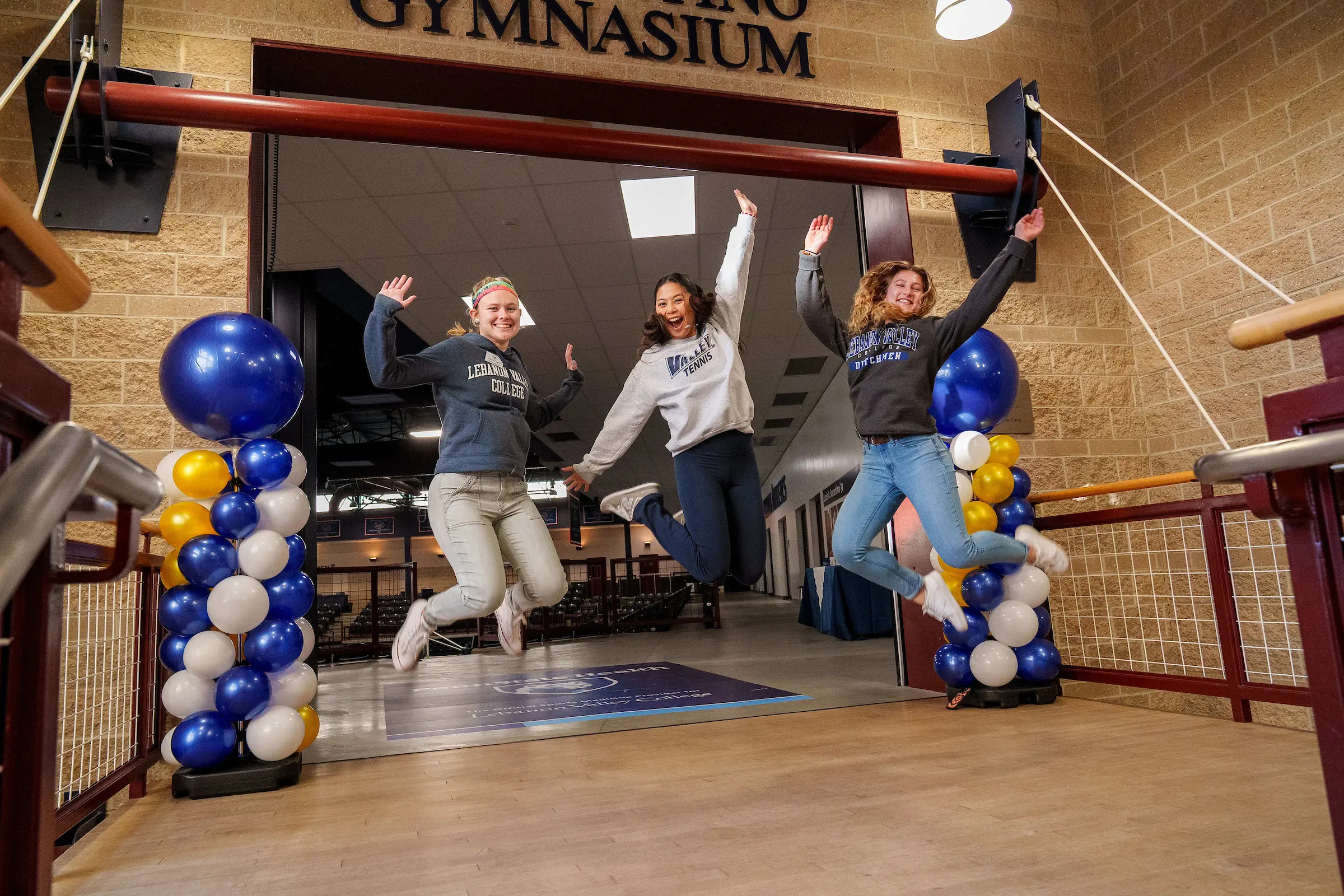 LVC students jump in air for photo during accepted student event