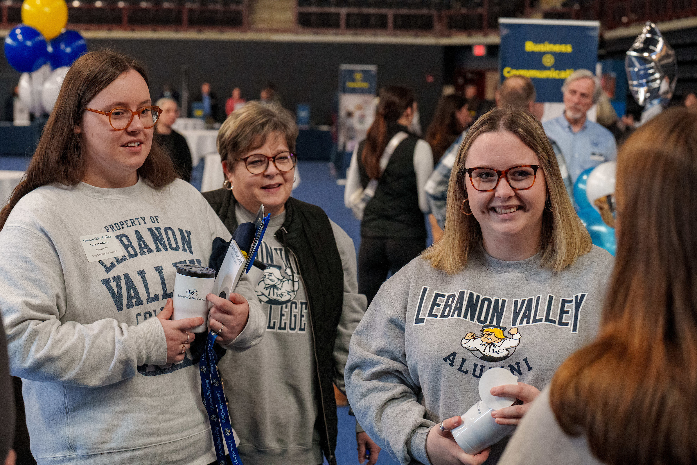 LVC accepted students and family chat with current student during event