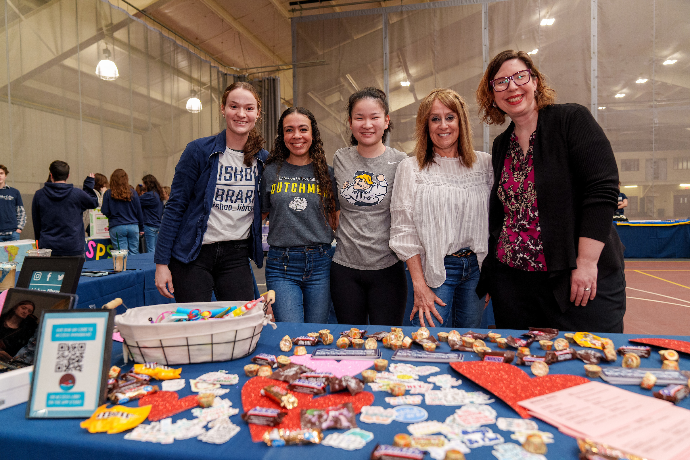 Library staff and student volunteers host table during accepted student event