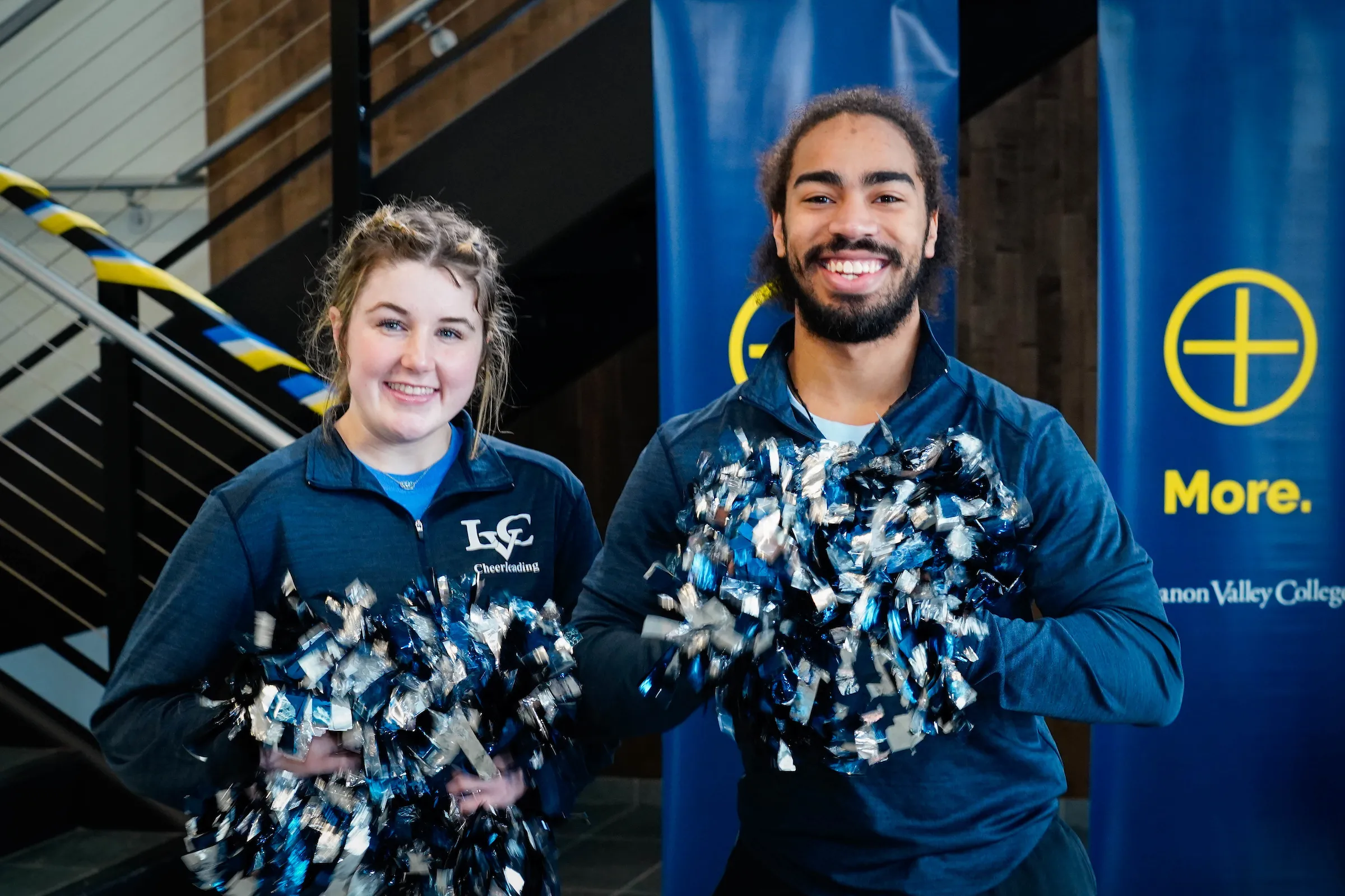 LVC cheerleaders smile with pom poms at LVC Live admitted student event