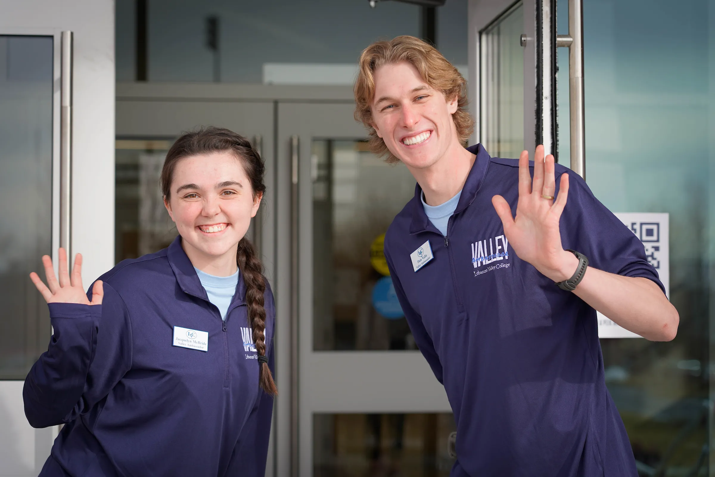 LVC Valley Ambassadors smile and wave at LVC Live admitted student event