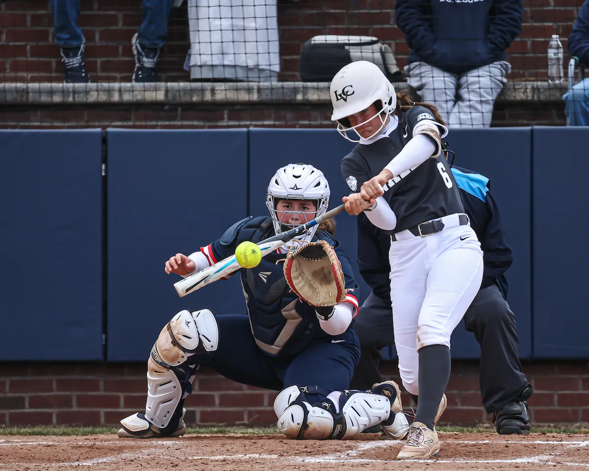 LVC softball player hits ball