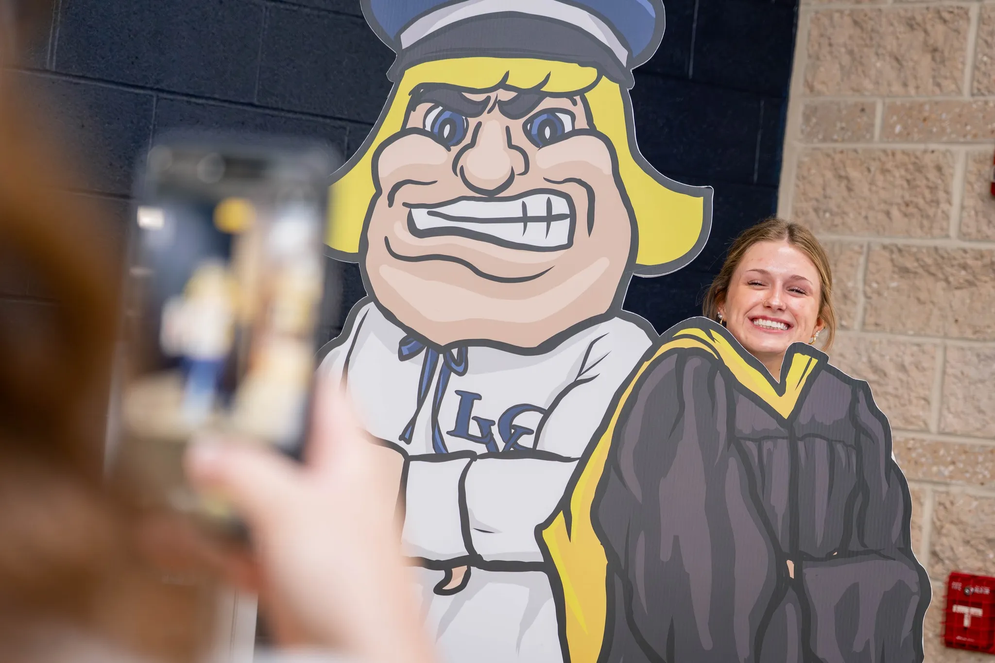 Student poses with Dutchman cutout