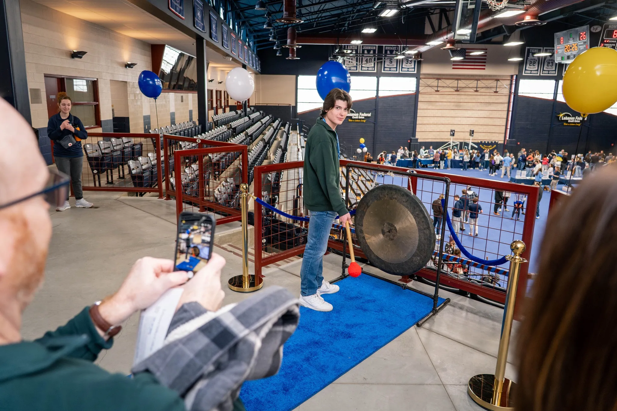 Student rings gong at admitted student event