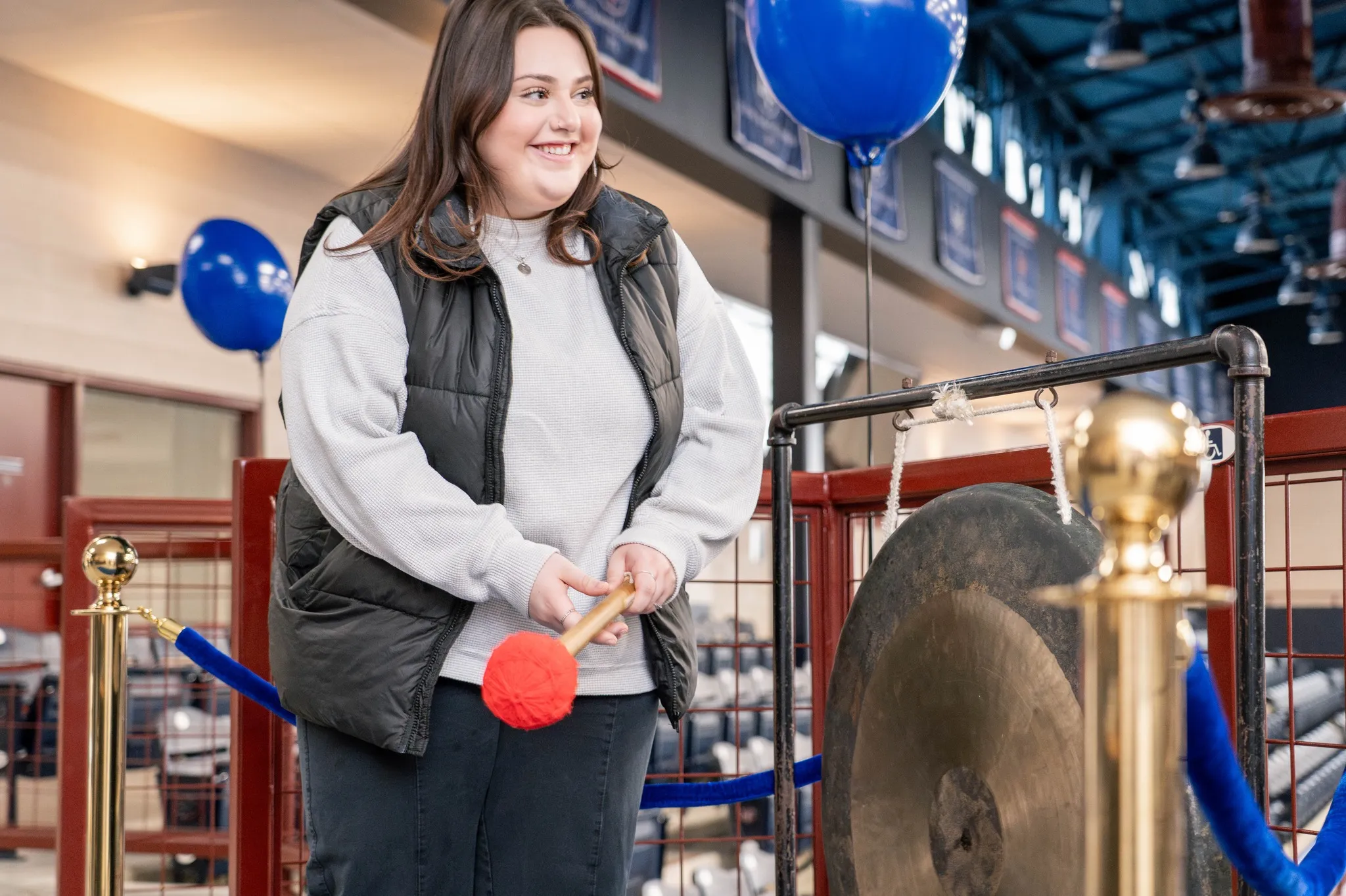 Student rings gong at admitted student event