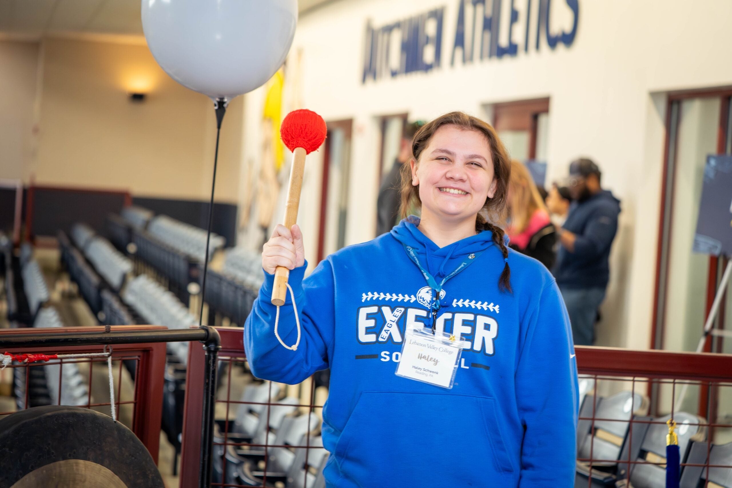 Newly enrolled student smiles at celebratory gong at LVC Live admitted student event