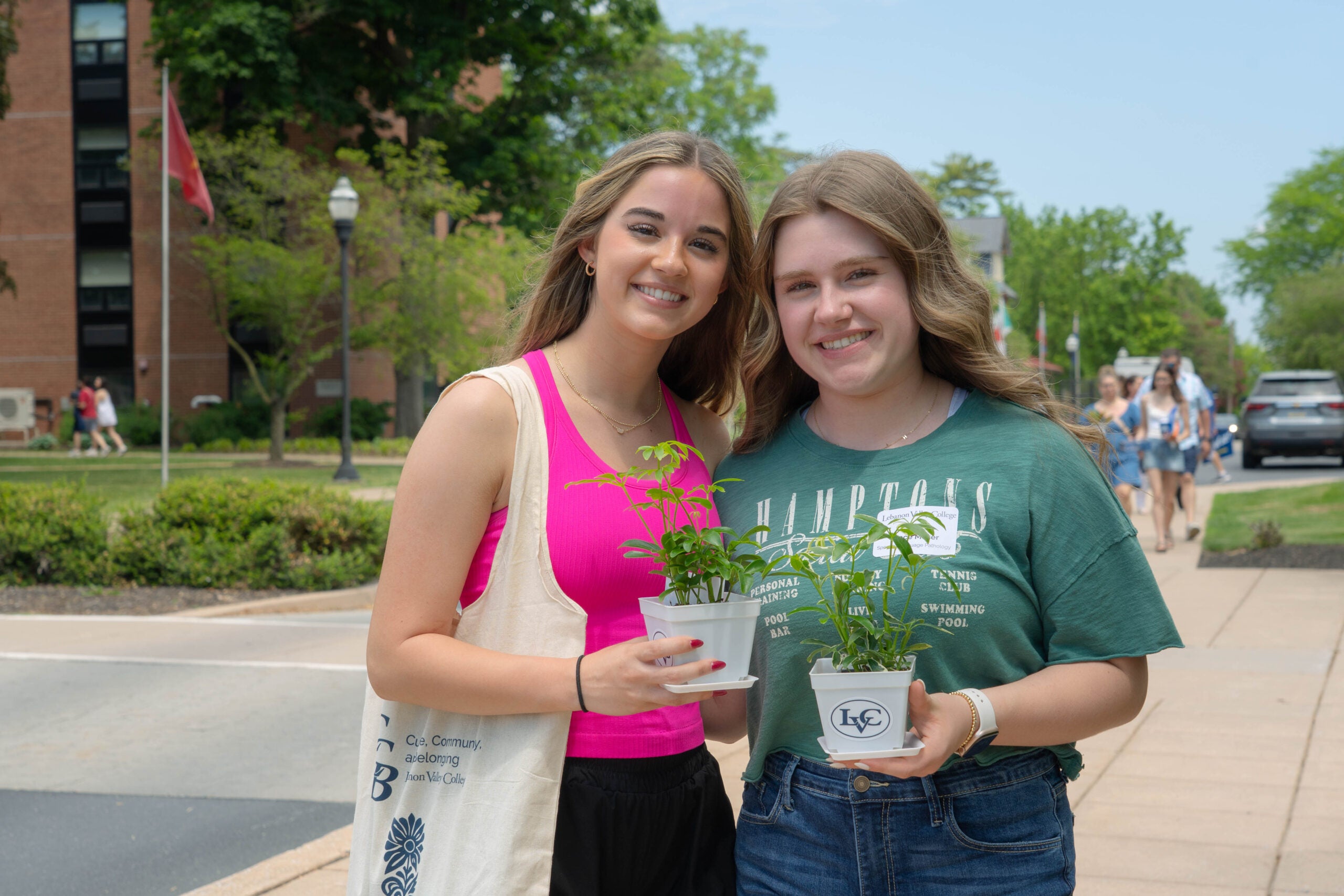 New LVC students smile holding plants at New Student Advising Day