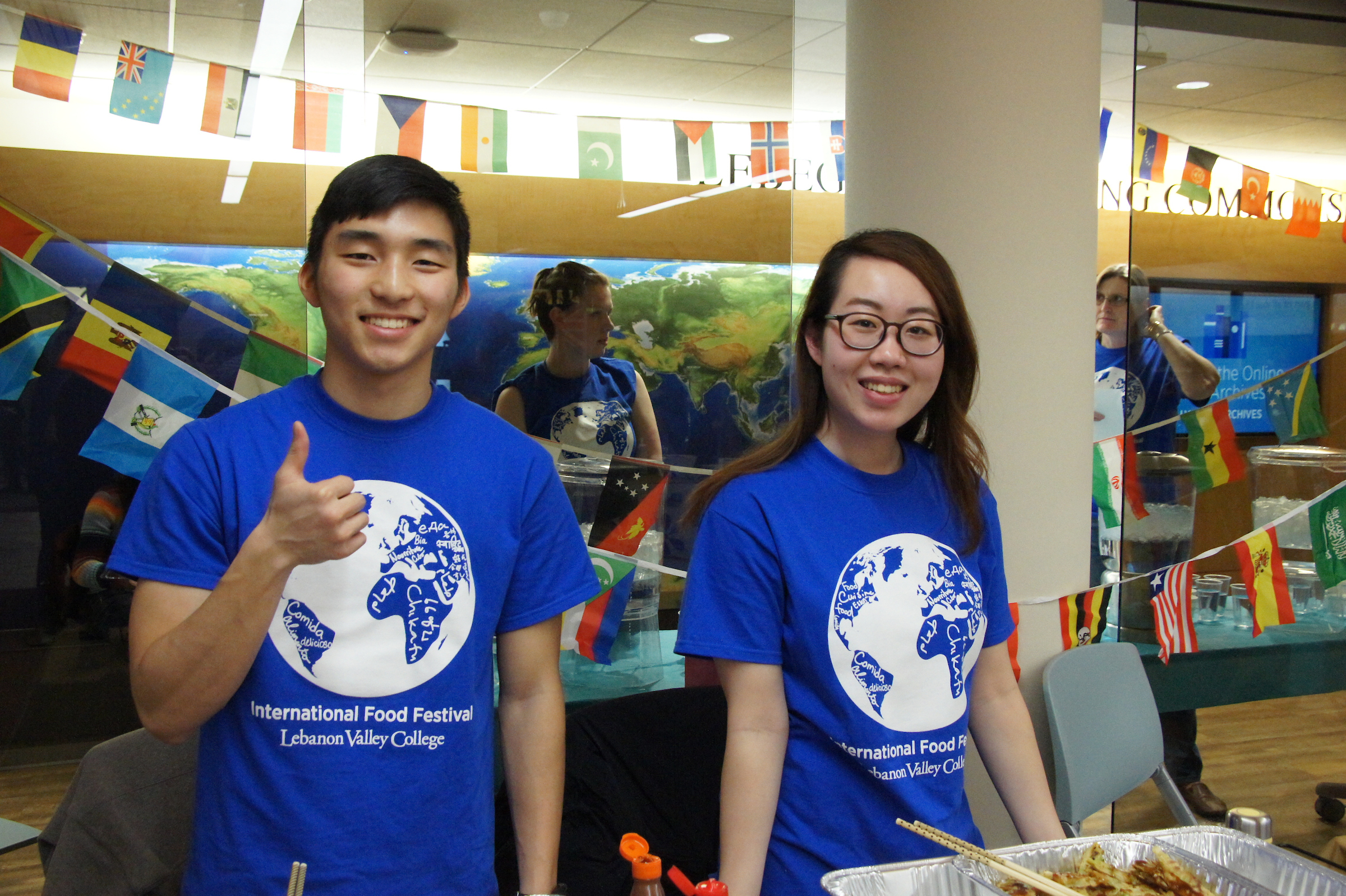 international students host table at international food festival