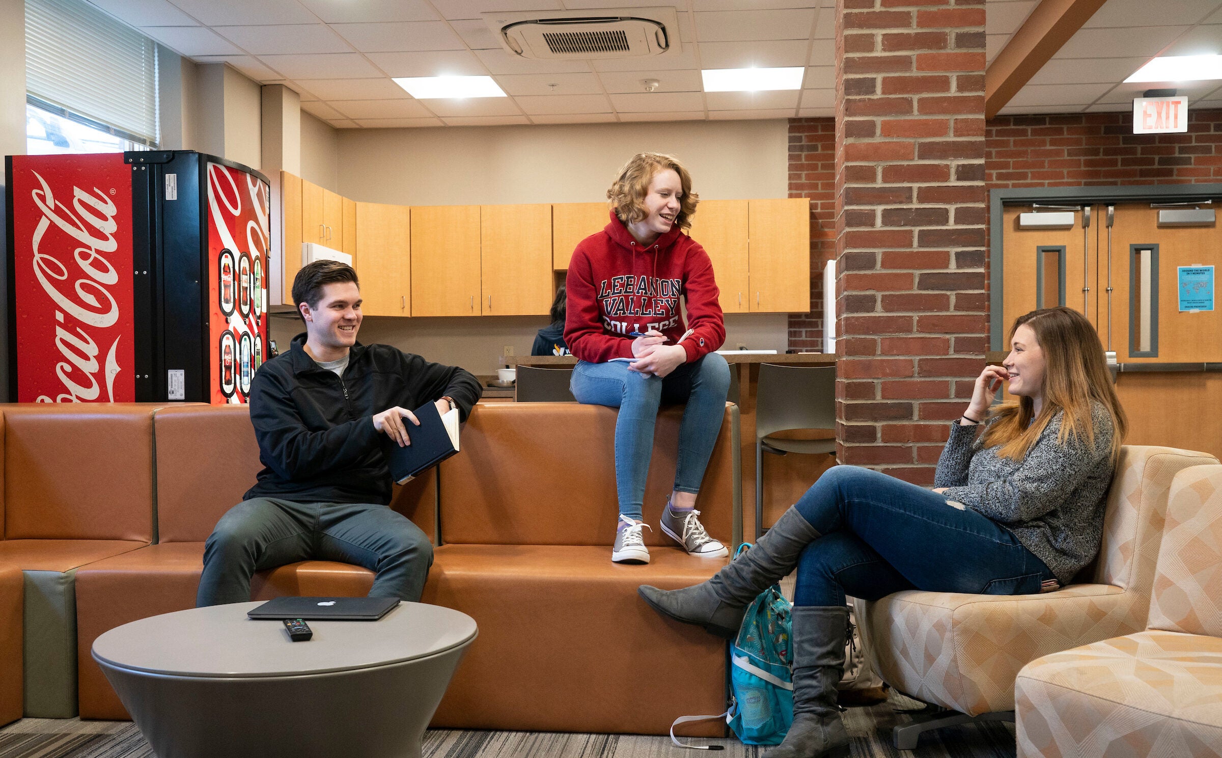 Students sit in dorm lounge
