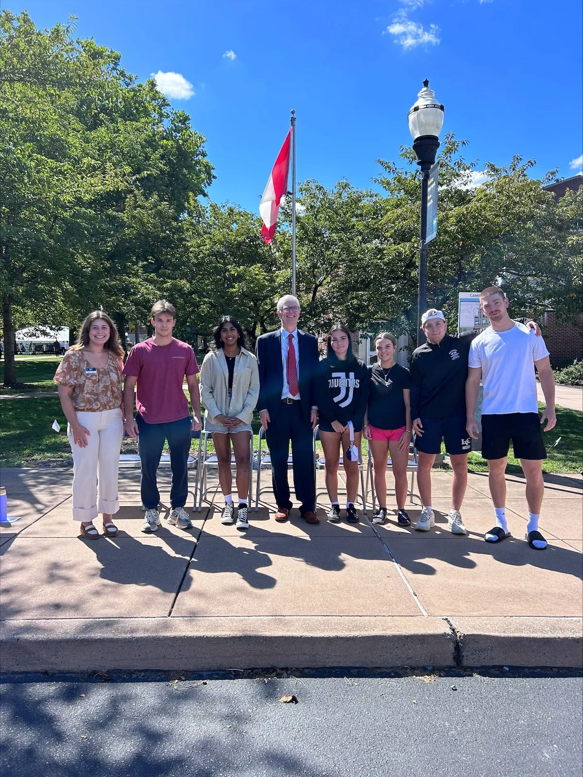 LVC international studens pose with President MacLaren at Flag Raising ceremony