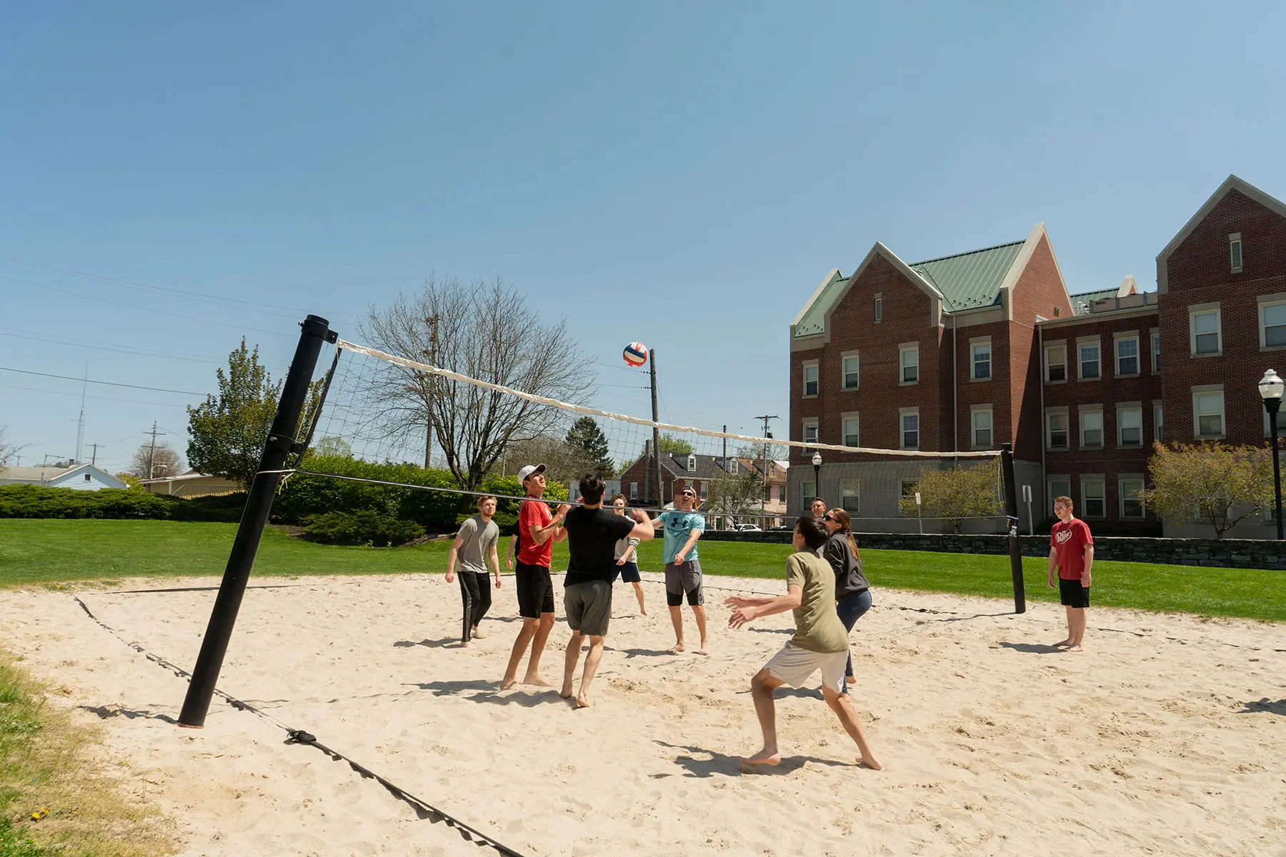 Students playing volleyball.