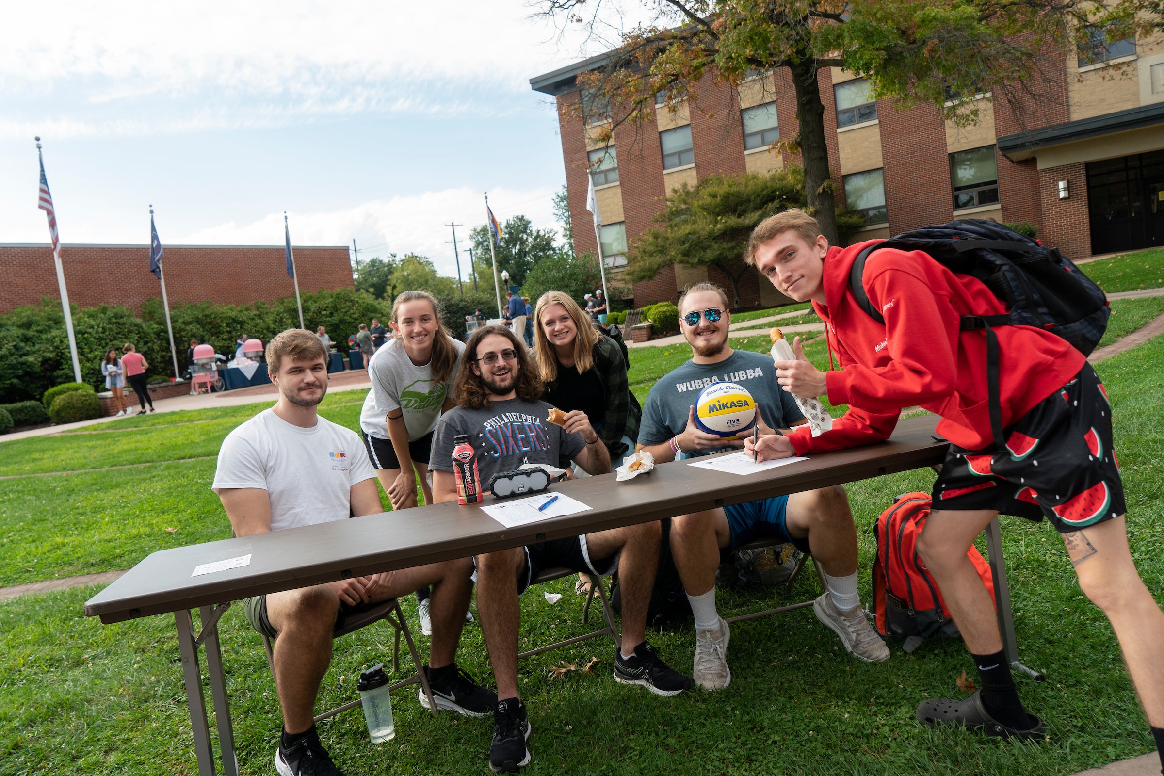 Volleyball club members host table at engagement fair