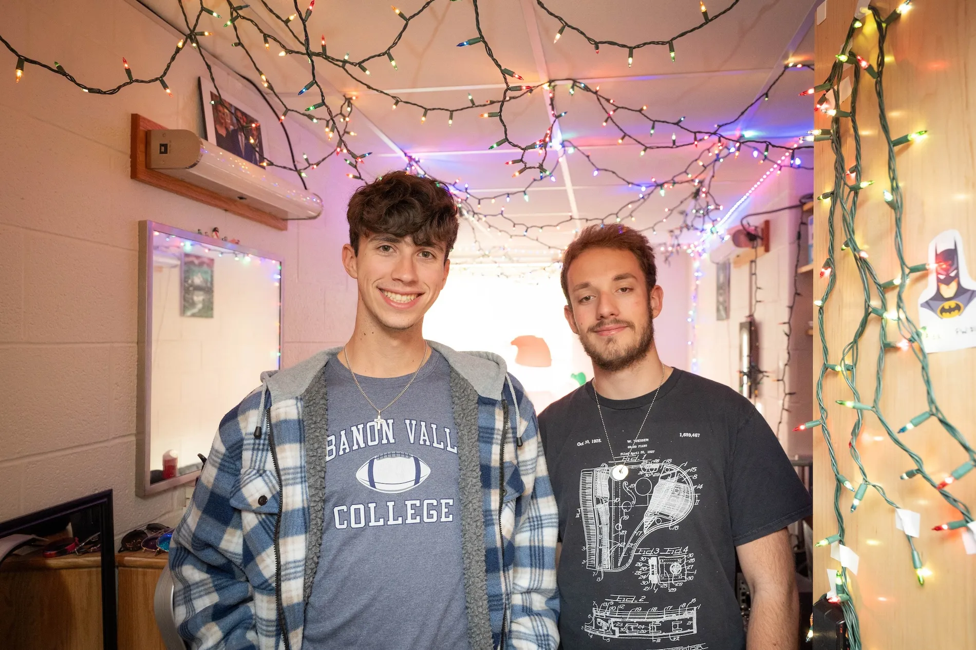 Students stand in doorway to dorm room in Funkhouser Hall