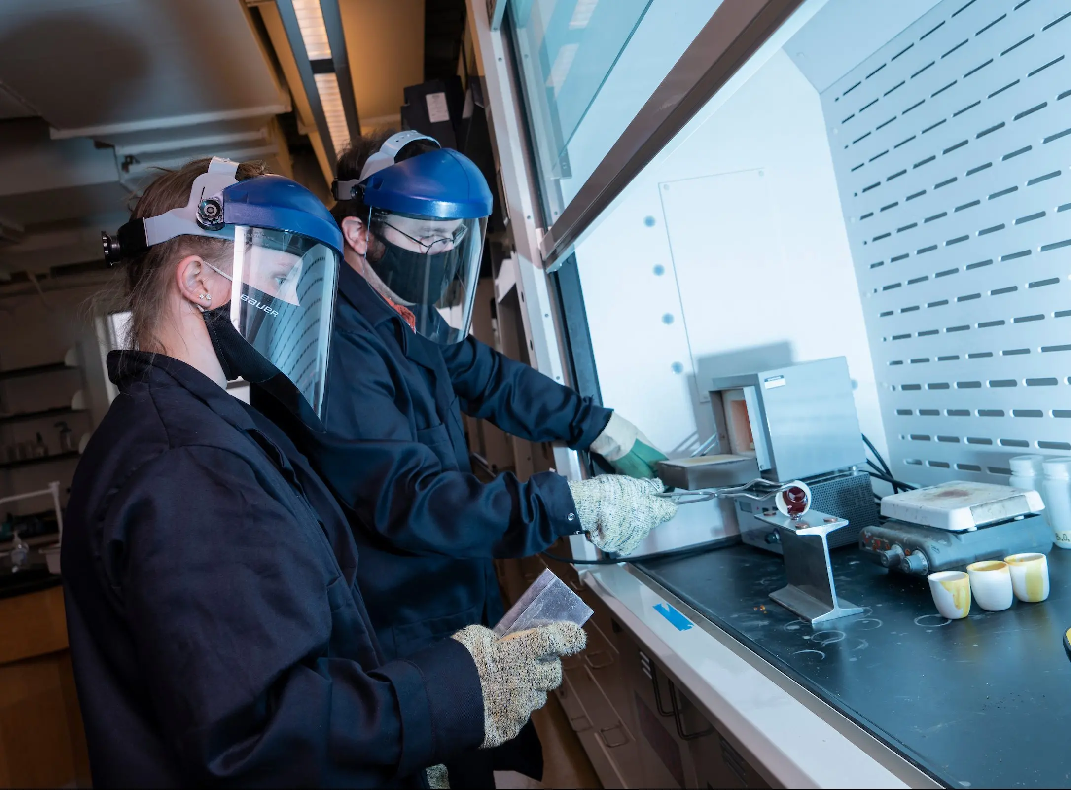 Keith Veenhuizen and Olivia Magneson conduct physics research