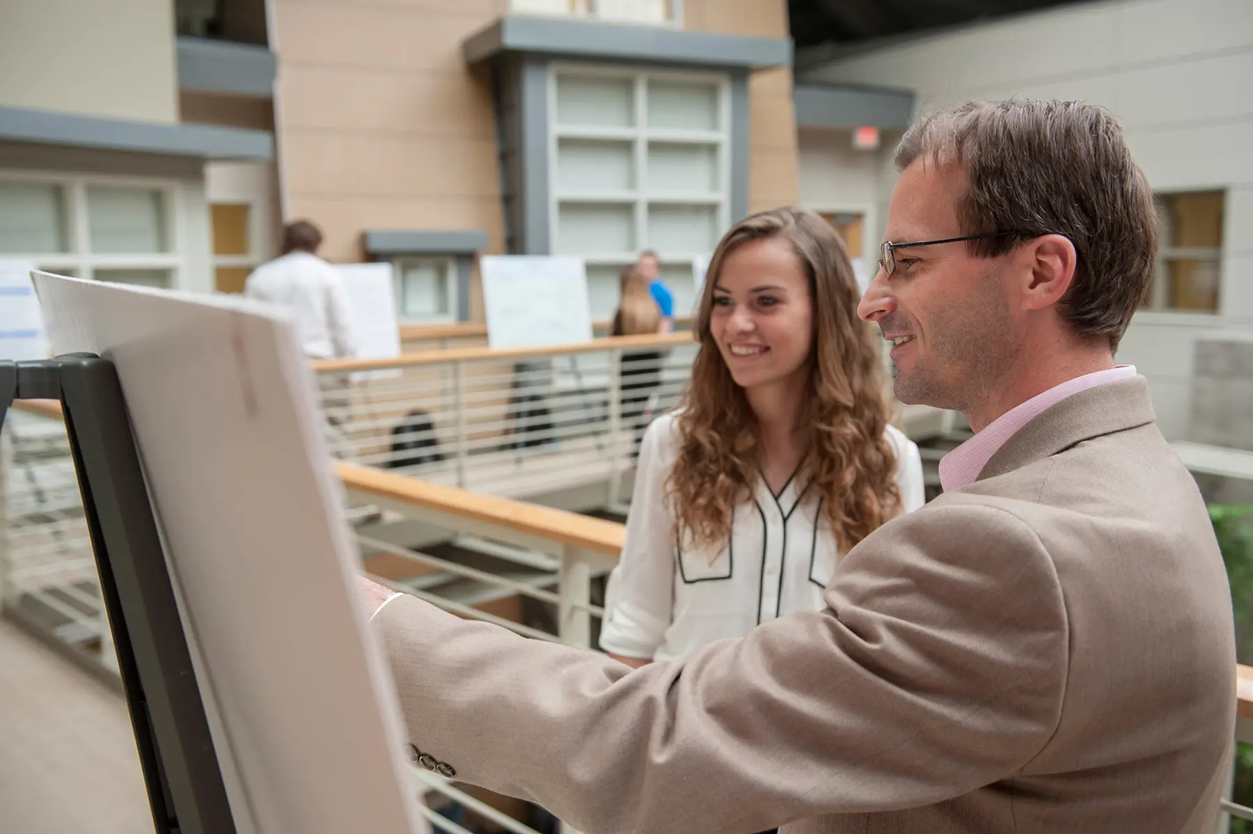 Psych student looking at display board