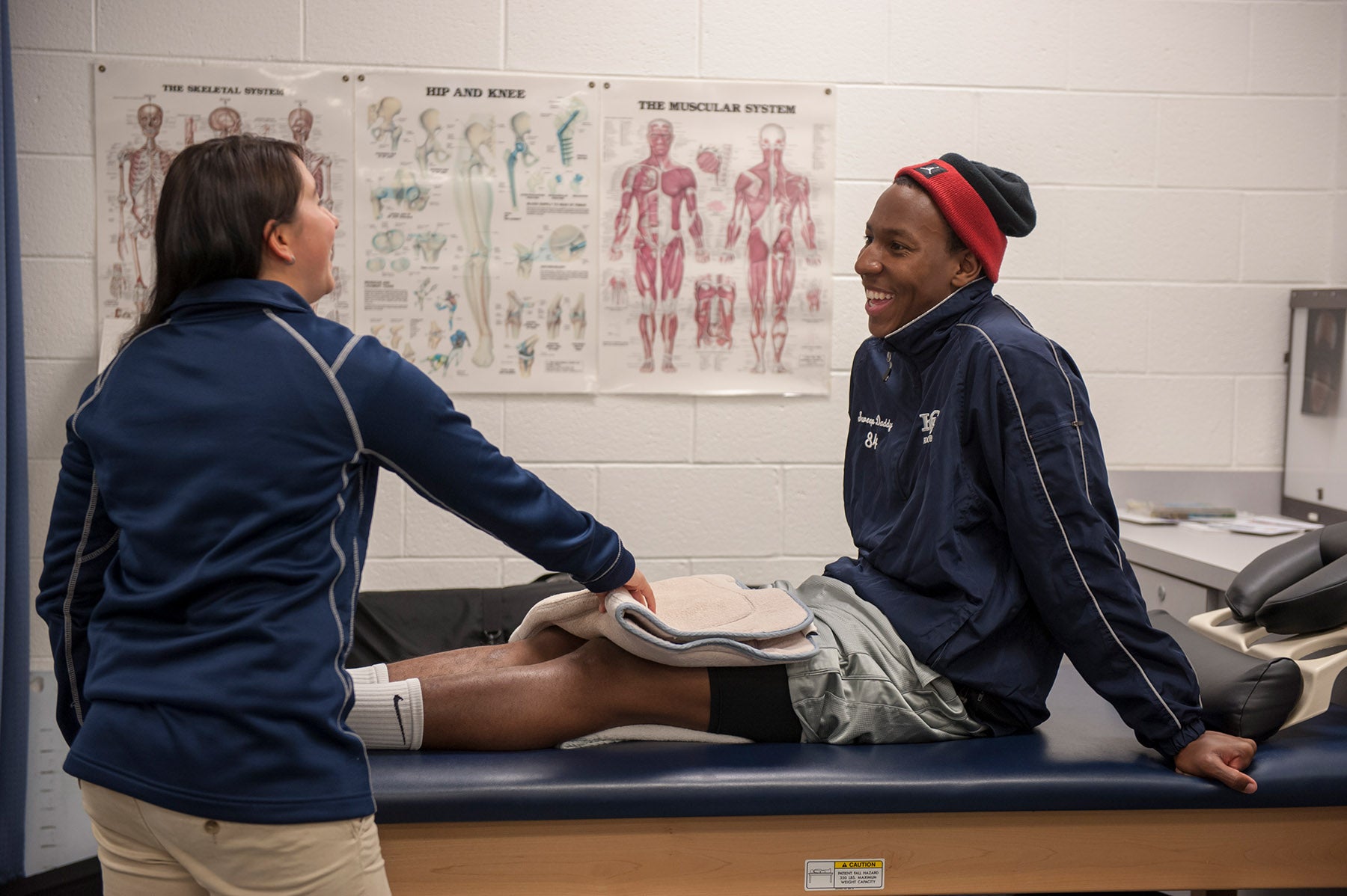 Athletic training students working with patient