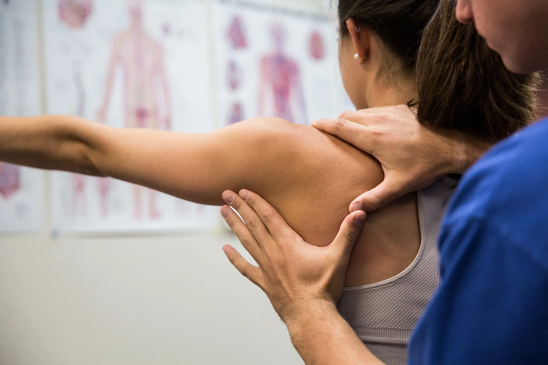 Physical therapist student working with patient.