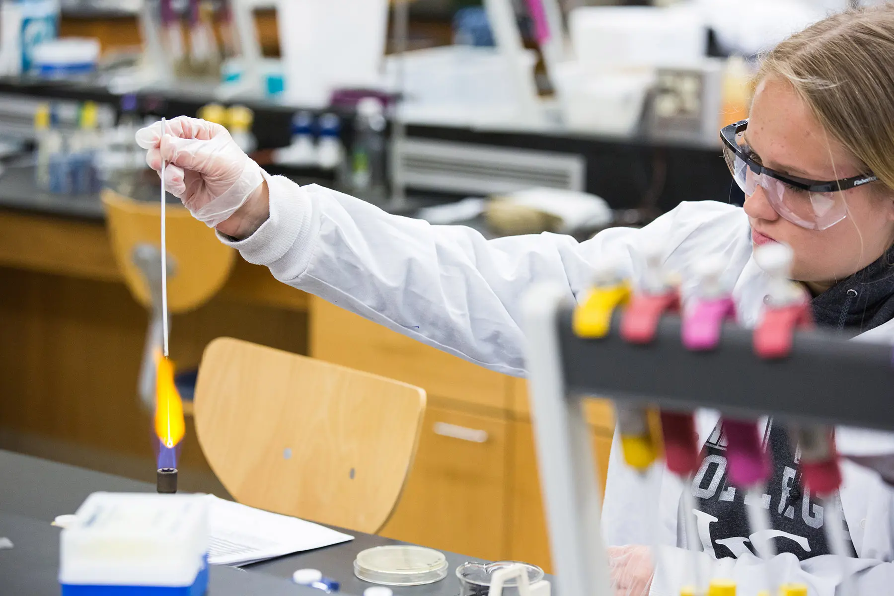 Student performing experiment in Chemistry lab