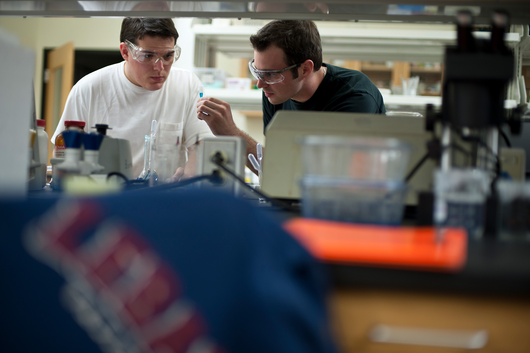 Two biochem students studying a sample together