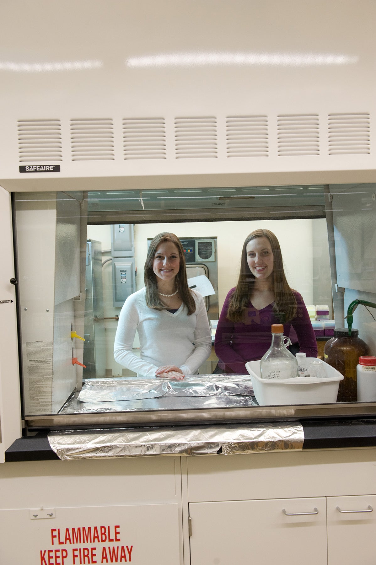 Two biochems tudents smiling in biochem lab