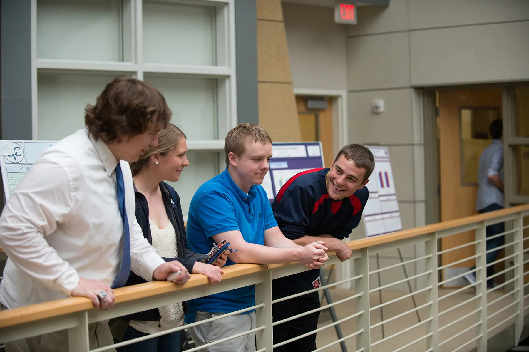 Psych students chatting on balcony