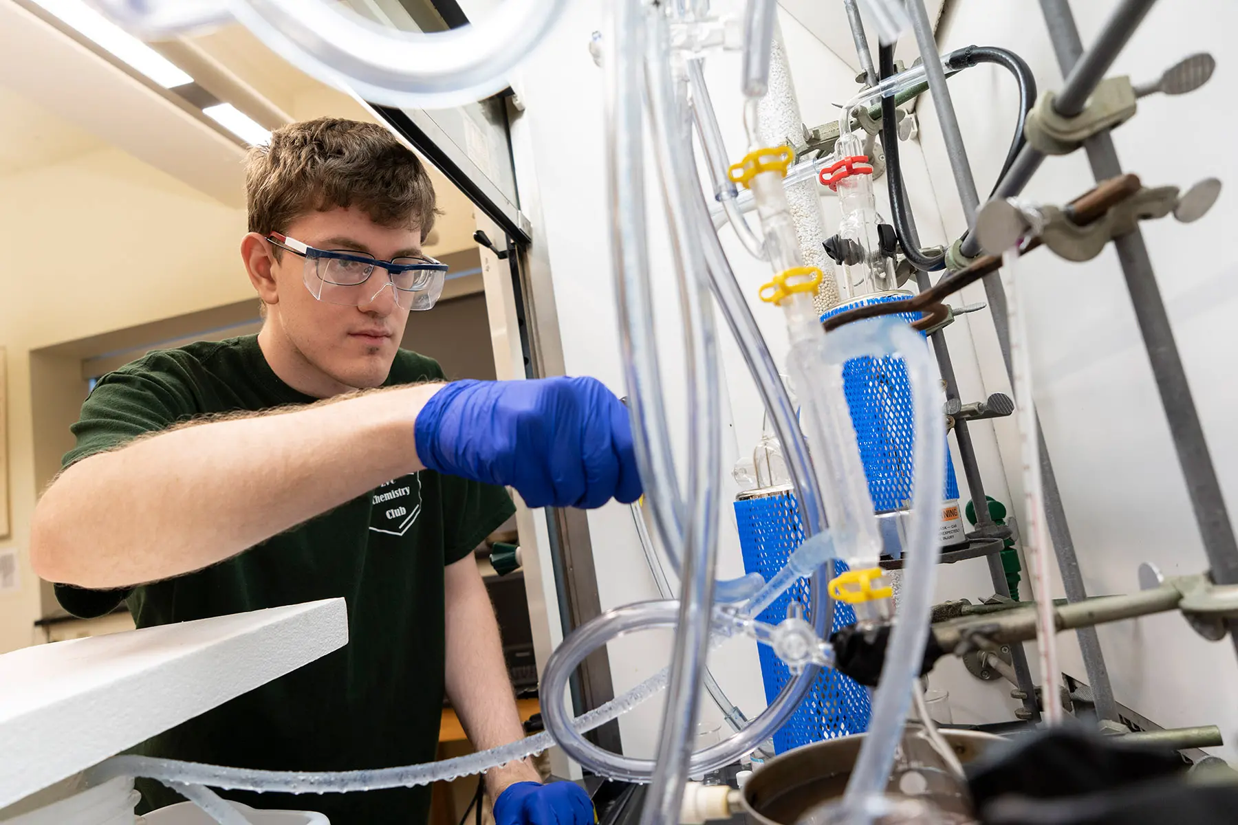 Student performing experiment in Chemistry lab