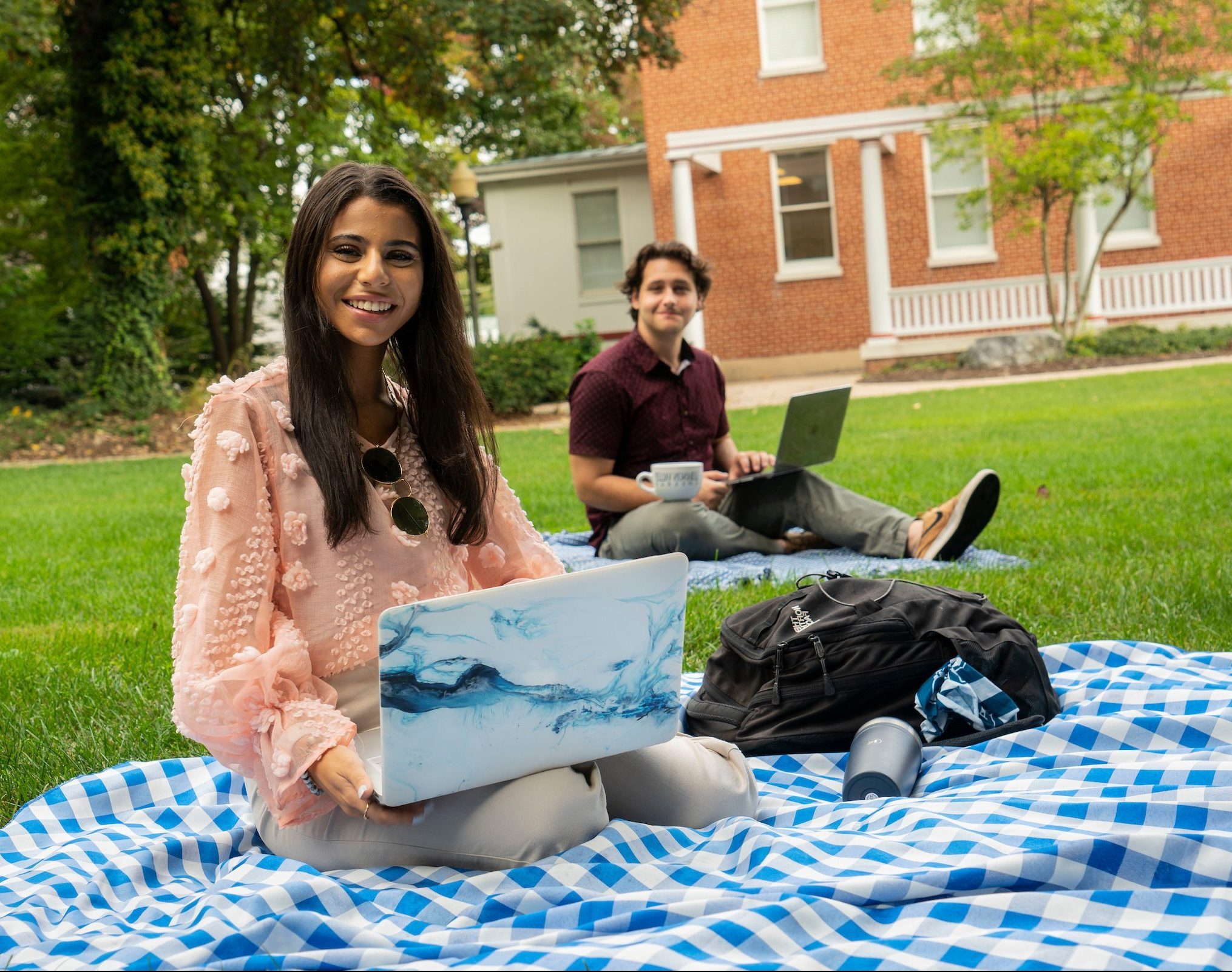 Students sitting outside studying