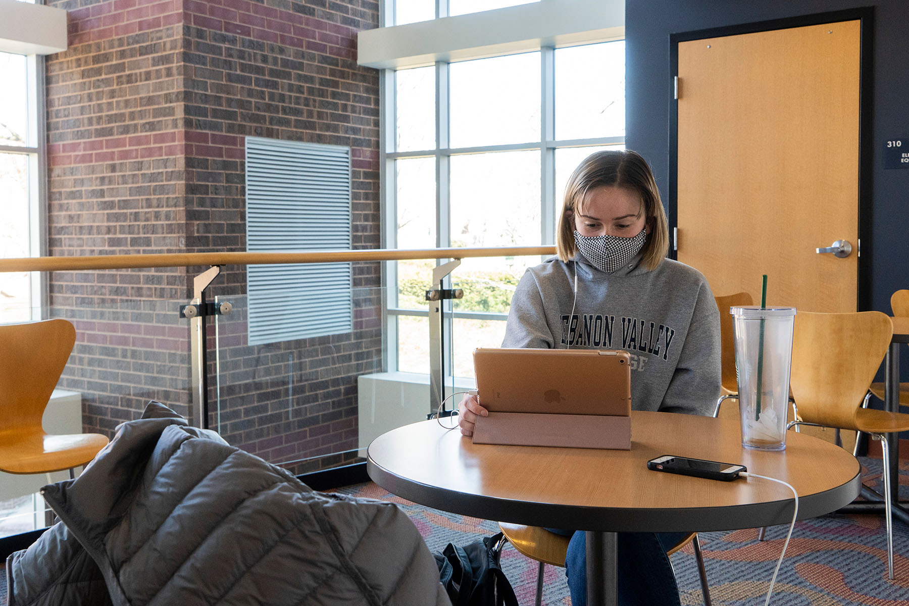 Student sitting at library table studying
