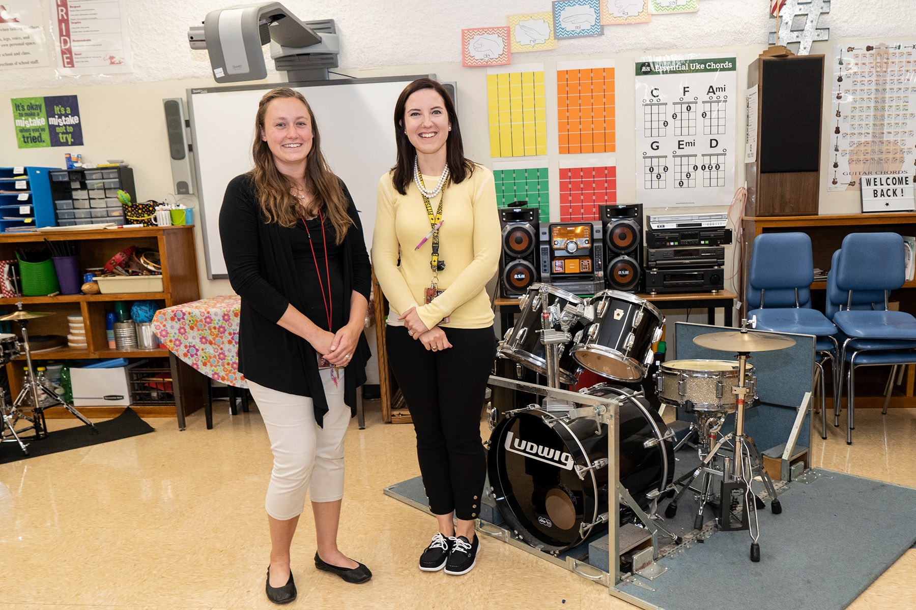 Music educators standing in classroom