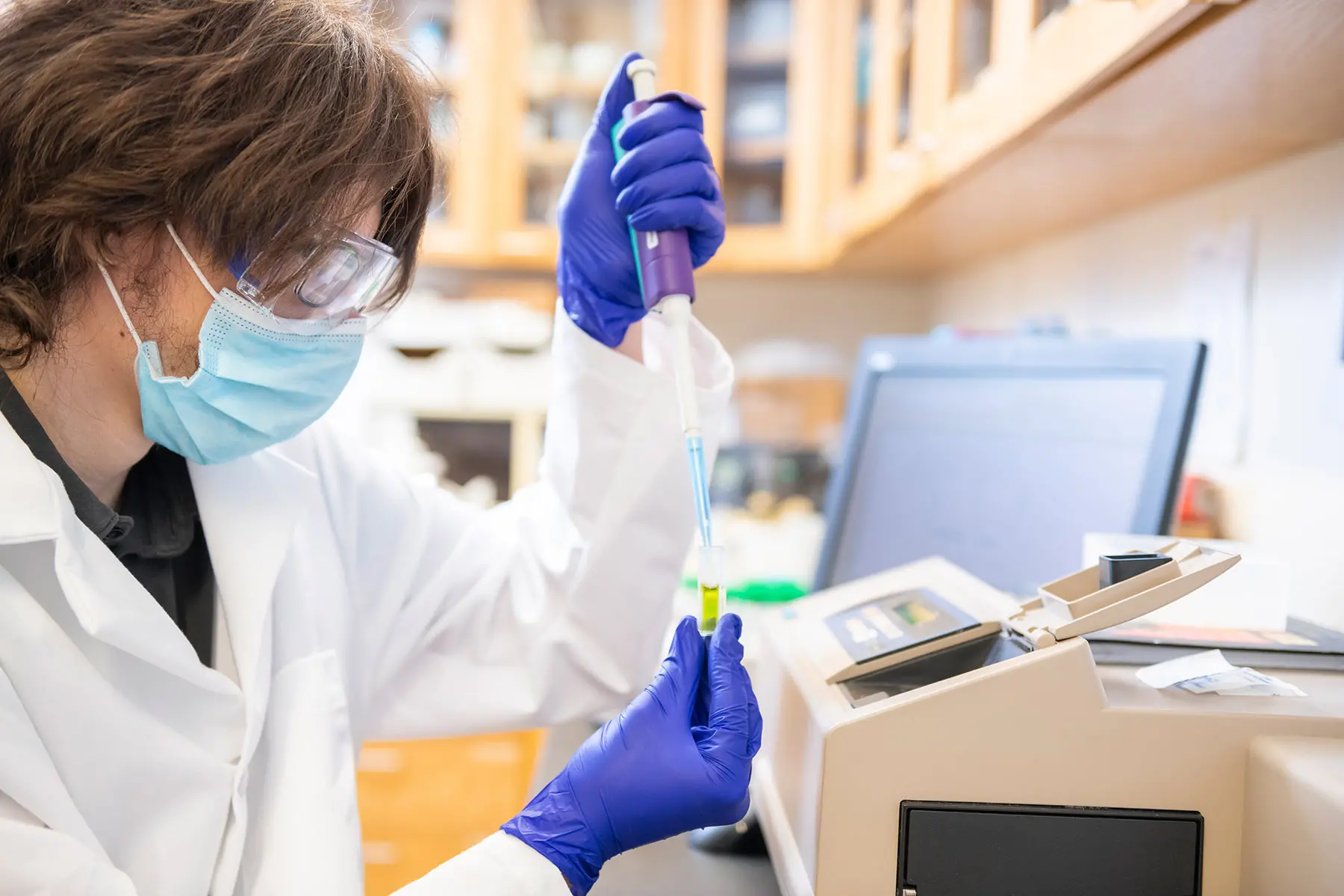 Medical Lab student using pipette