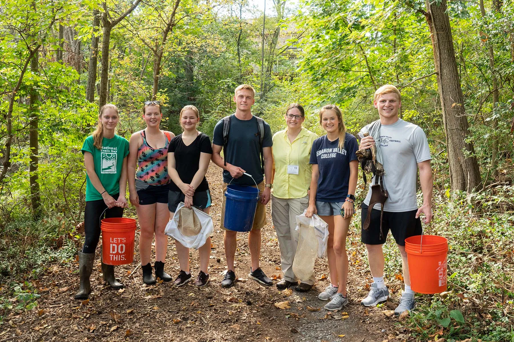 Students posing after researching outdoors in the field