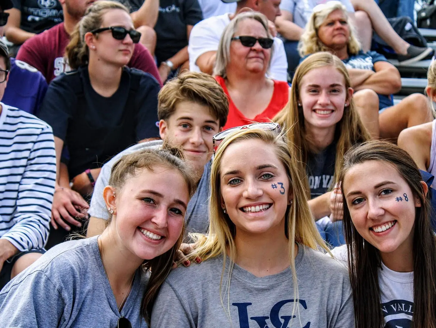 Students at football game.