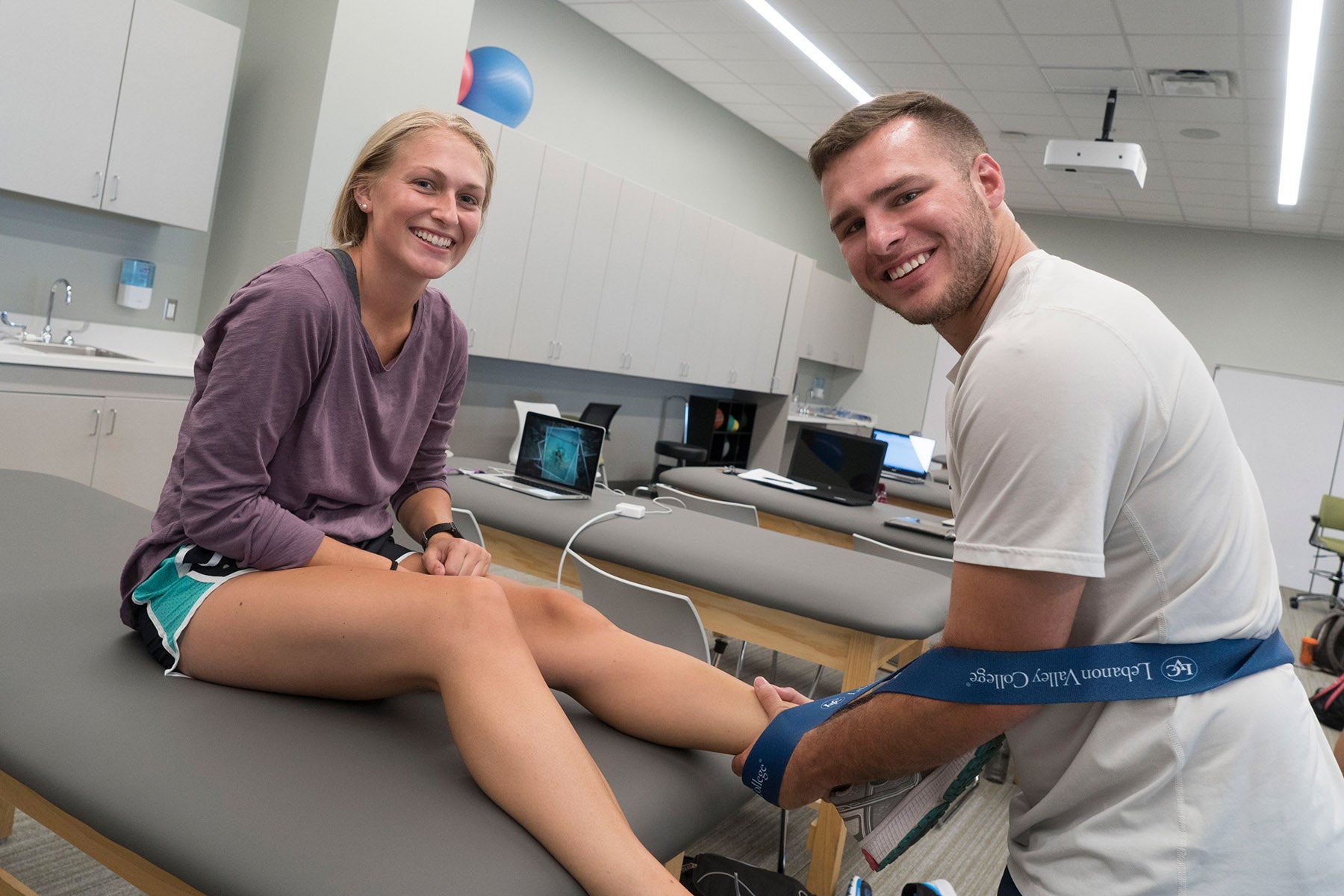 Two physical therapy students in the lab