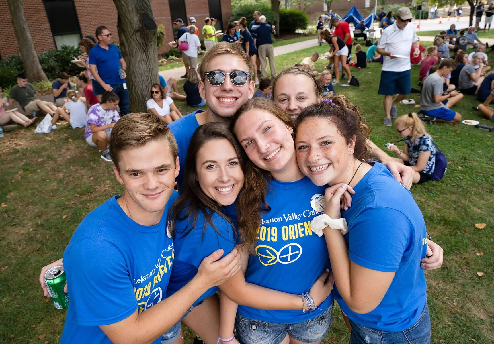 Students smiling and hugging.