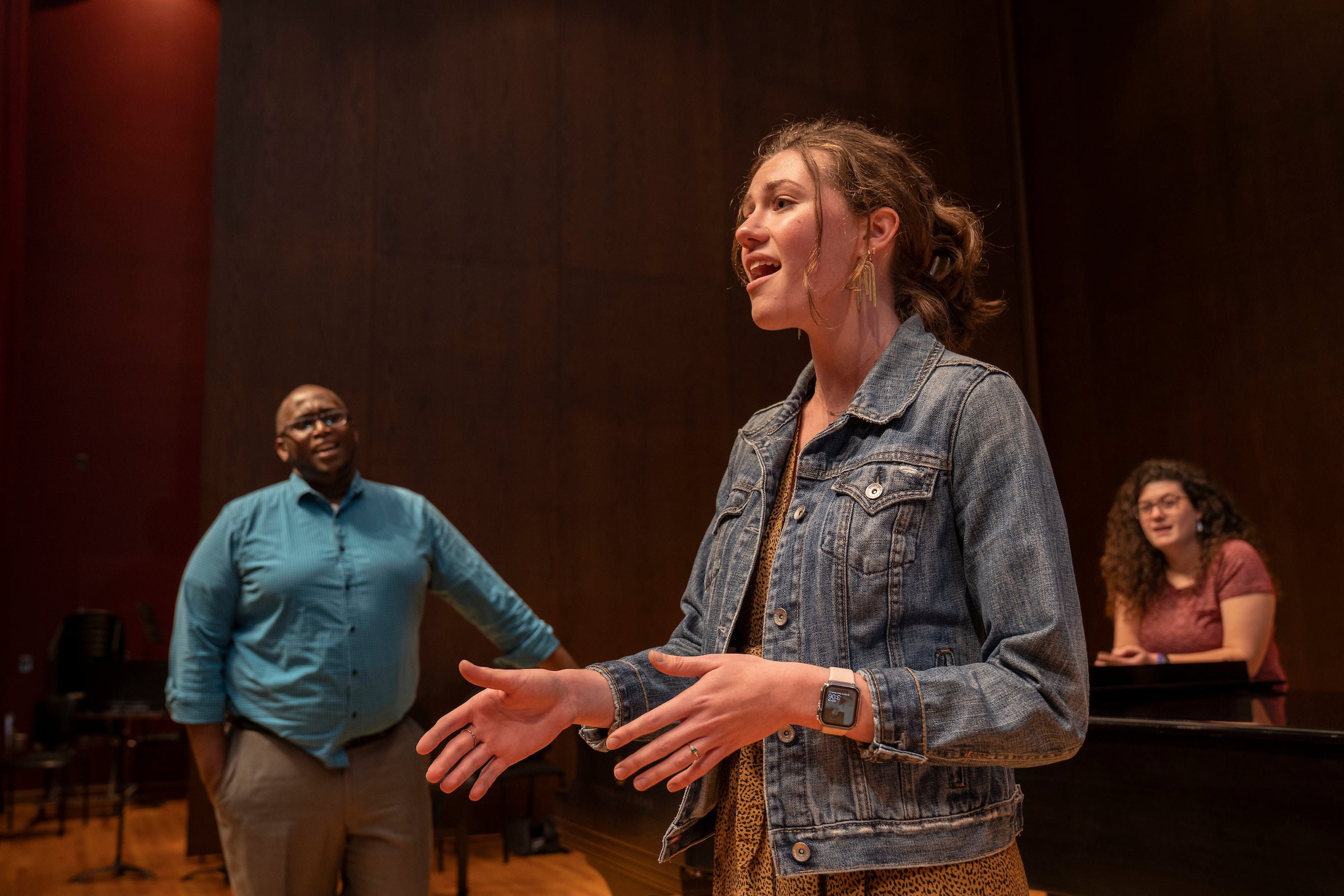 Student sings on stage during music theatre class