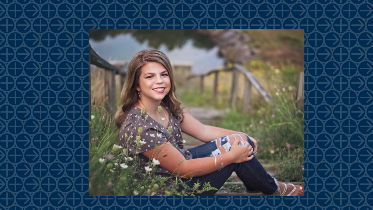 Rachel Casella in a field of flowers