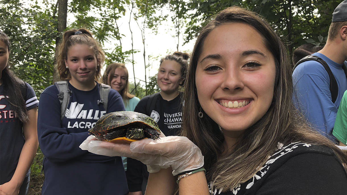 Environmental students with turtle