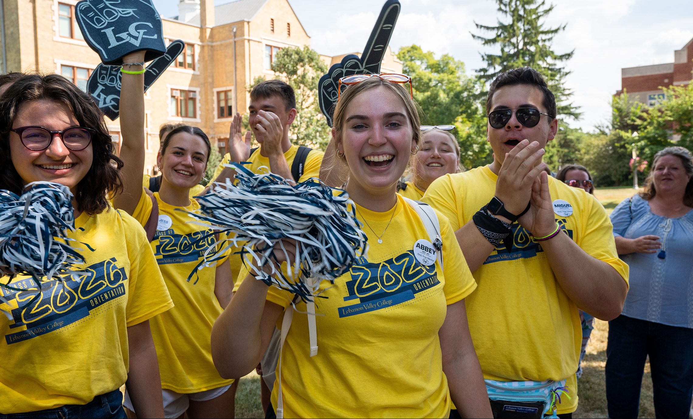 Student ambassadors cheer for new students at student orientation