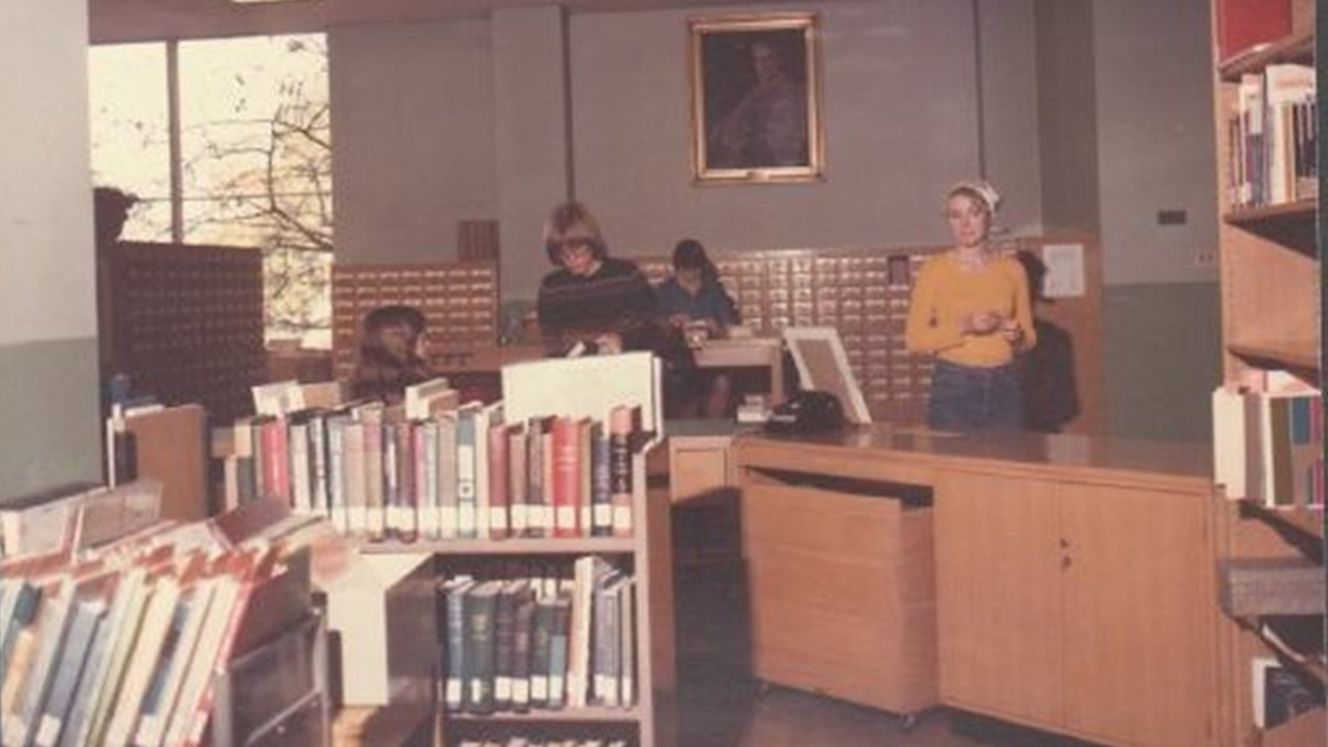 Students and staff in the library