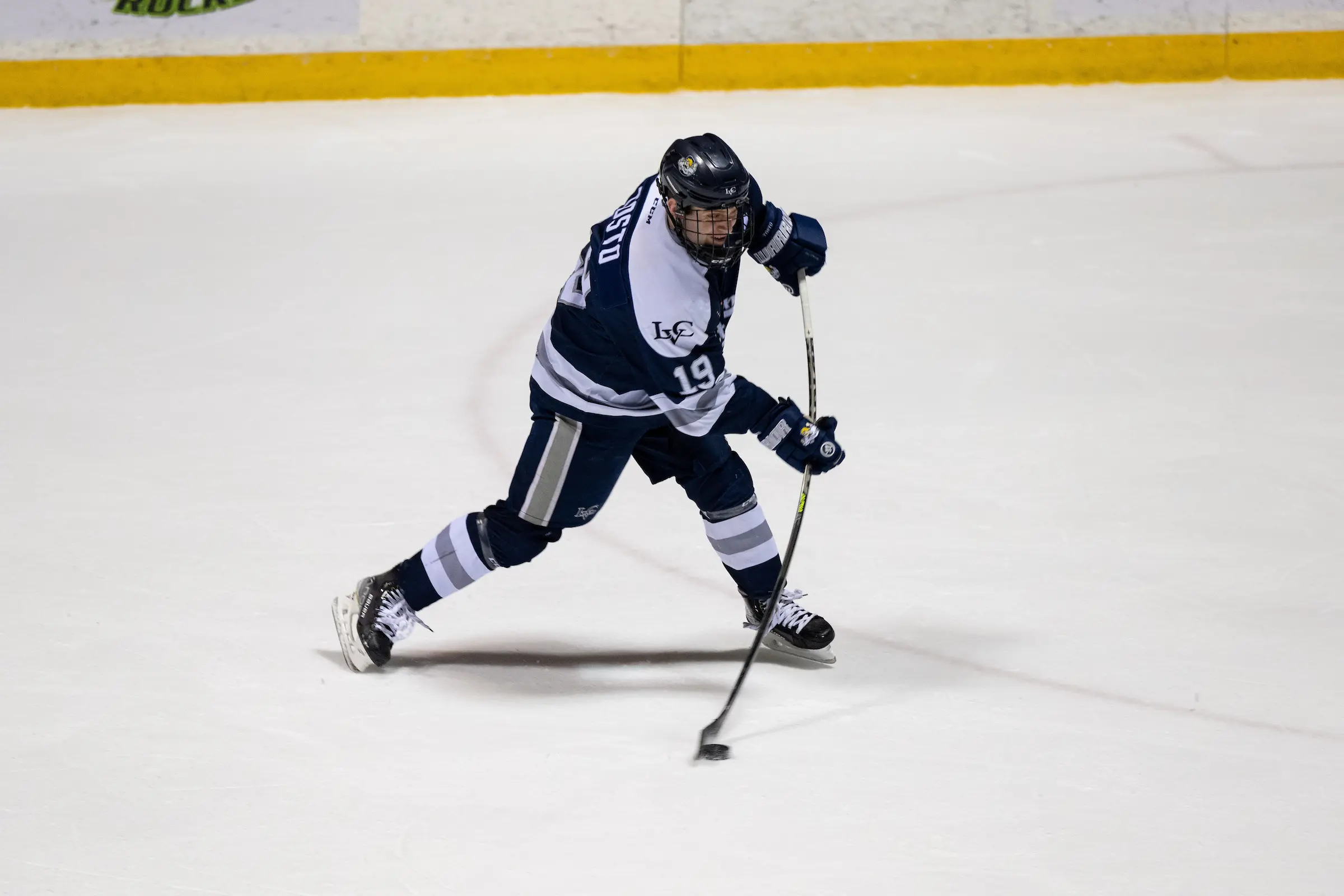 Blake Tosto shooting puck for LVC men's ice hockey