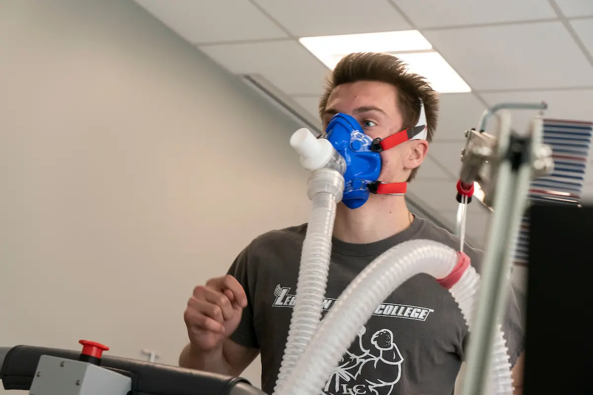 Exercise science student runs on treadmill