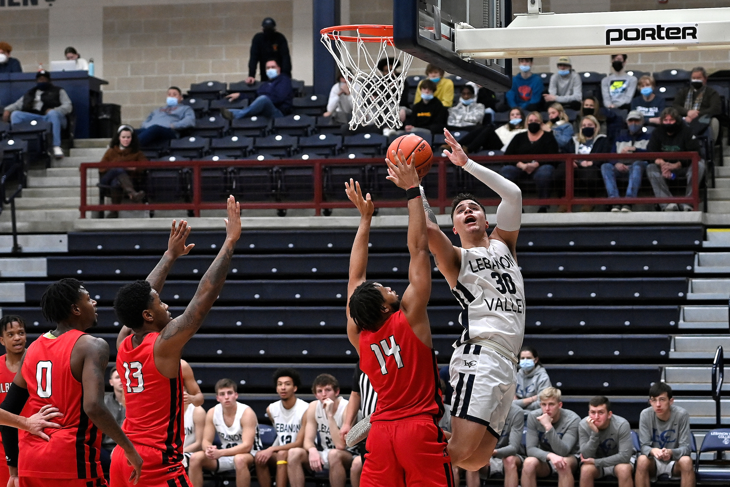 Collin Jones goes for a contested layup for LVC Men's Basketball