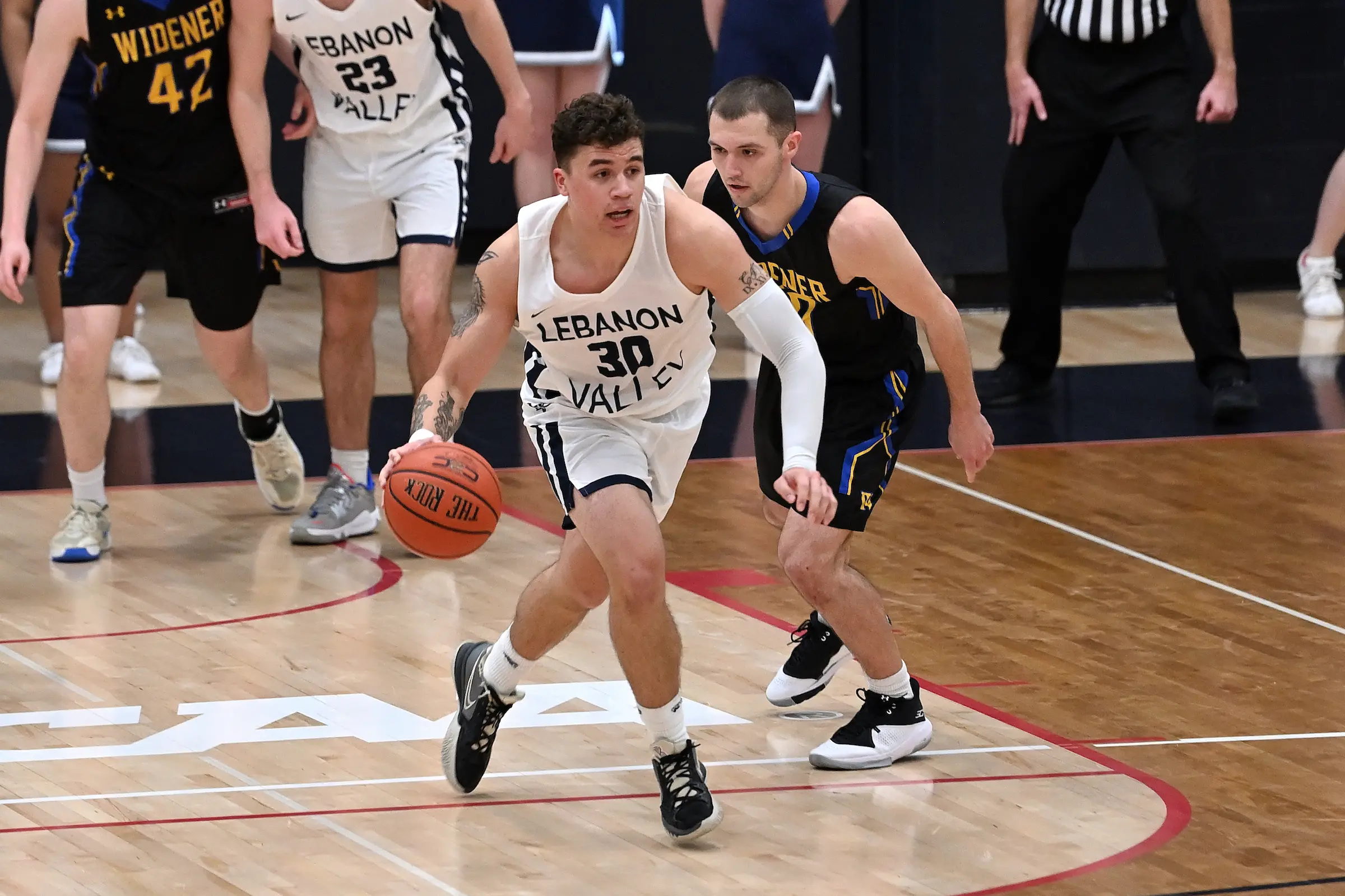 Collin Jones dribbles ball for LVC men's basketball