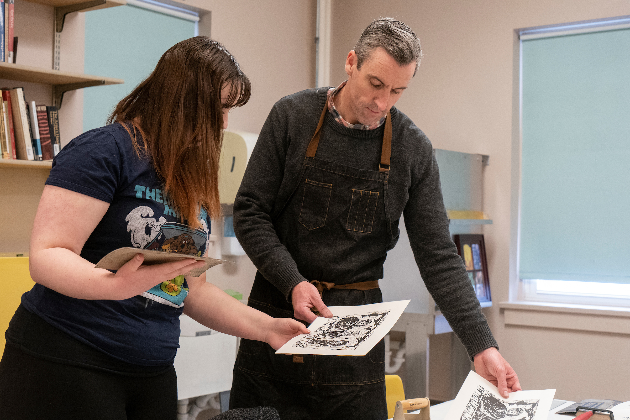 Student and instructor in printmaking class