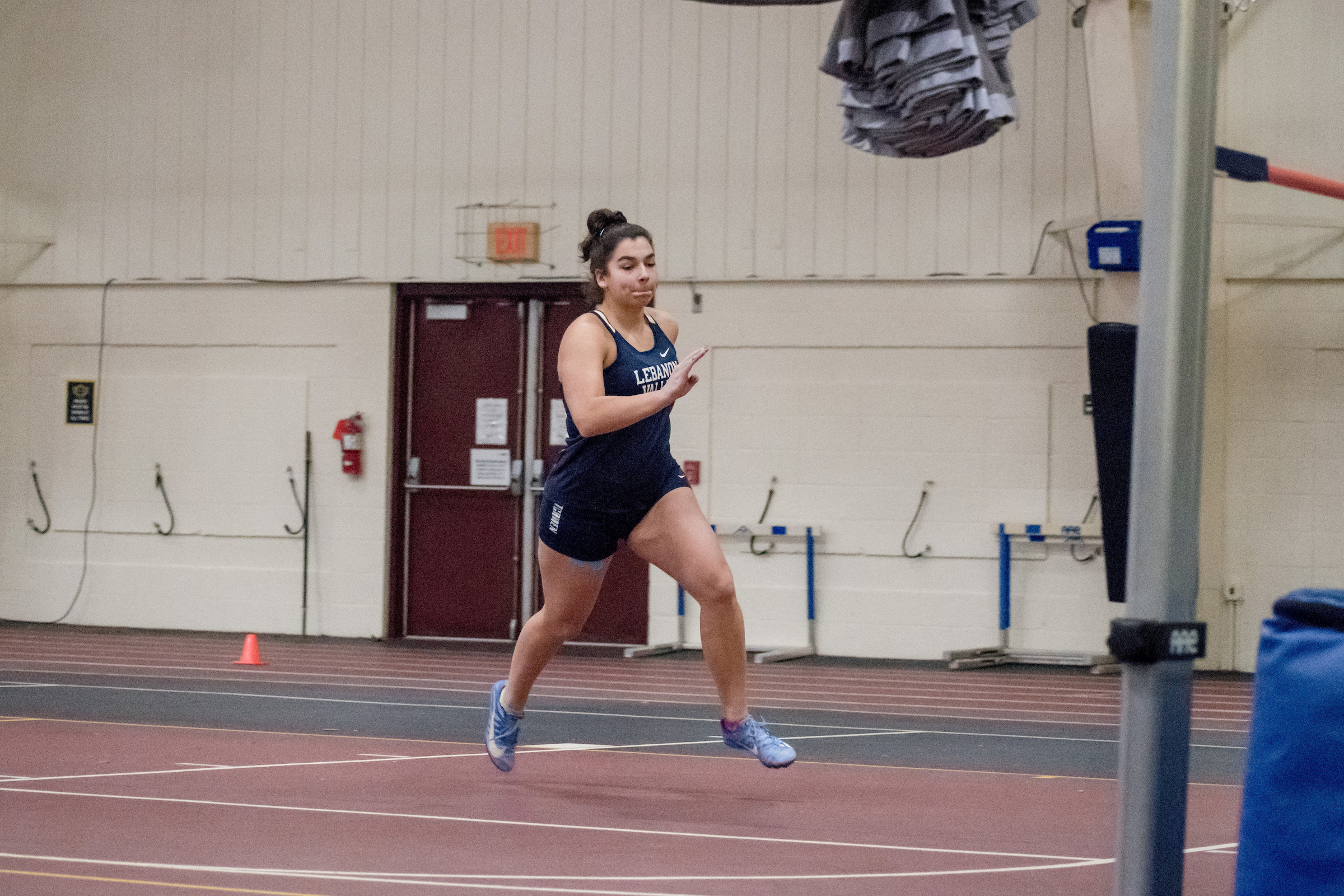 Greta Plechner runs indoor track