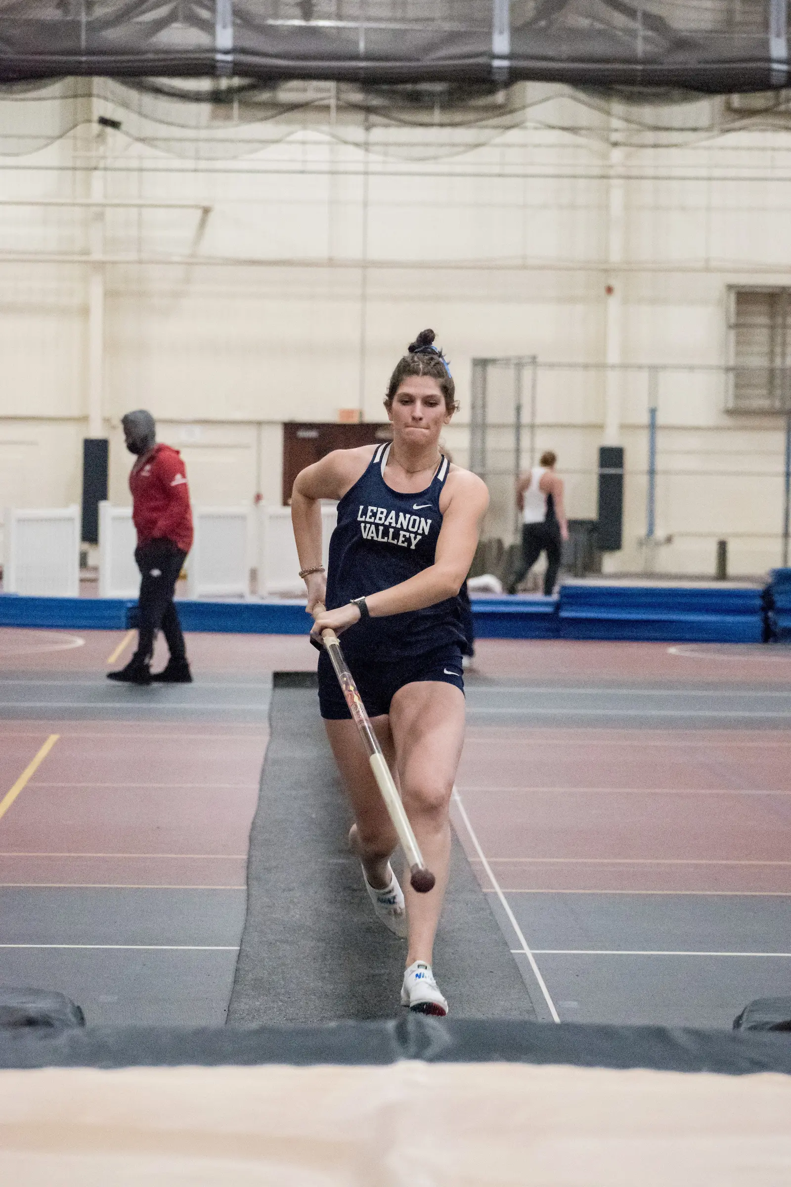 Sidney Wike runs with pole at Track and Field Dutchman Invitational