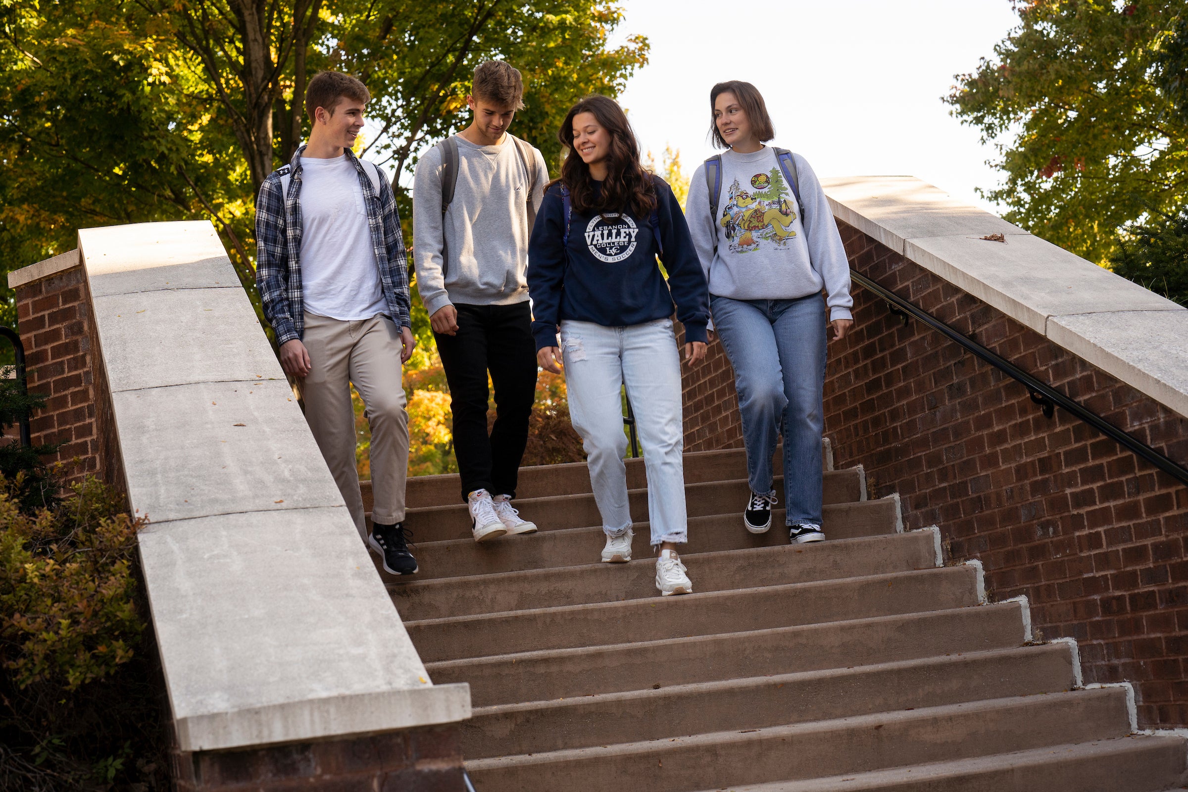 students walking down steps on campus